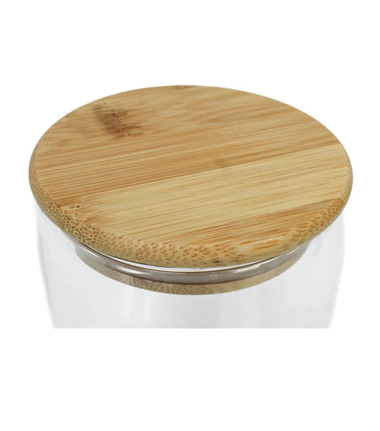 Close-up of a wooden lid on a Double Wall 350ml Glass Tumbler with a smooth natural finish and clear glass rim visible beneath.